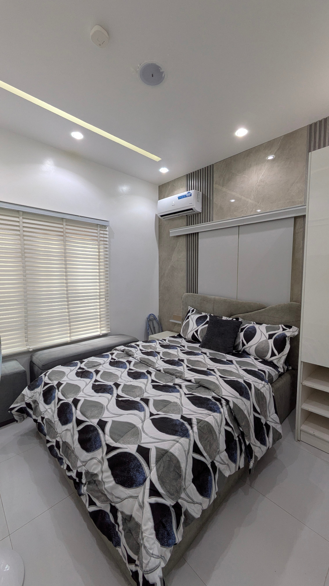 Second bedroom with grey patterned bedding