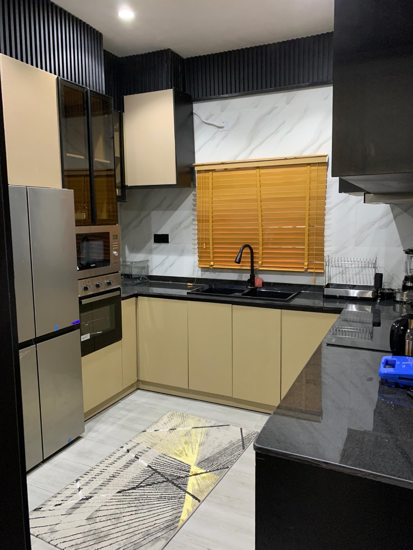 Chef's kitchen with marble backsplash and gold accents