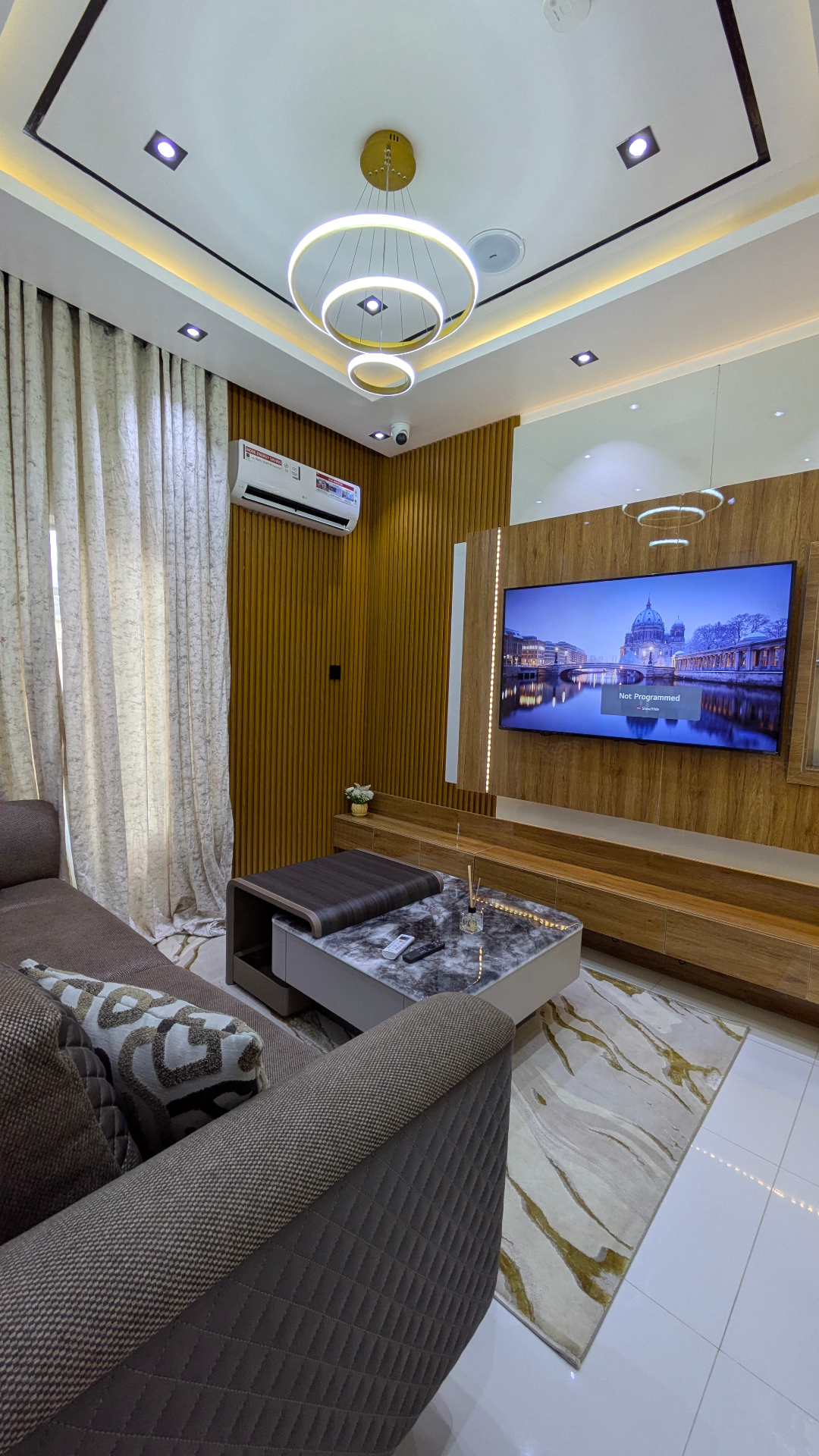 Second sitting room with fluted wood panel wall